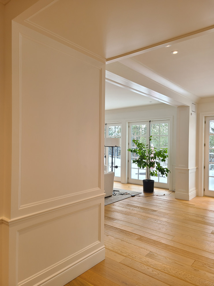 Huge transitional home design photo in Montreal