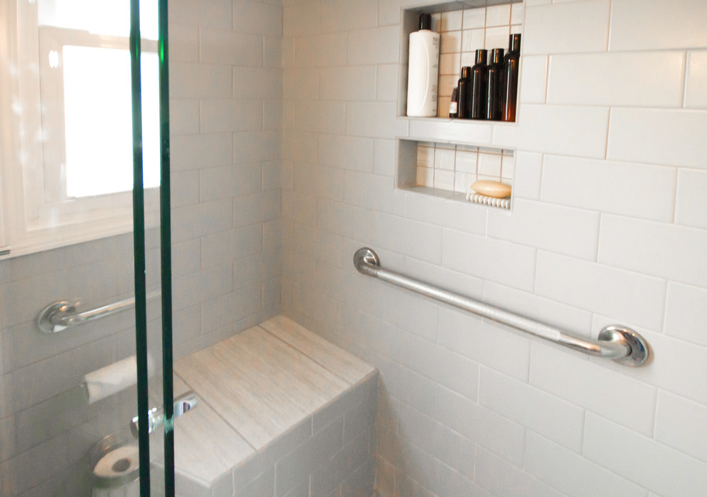 Mid-sized transitional master bathroom in St Louis with an alcove shower, a two-piece toilet, gray tile, ceramic tile, grey walls, porcelain floors, a wall-mount sink and a sliding shower screen.