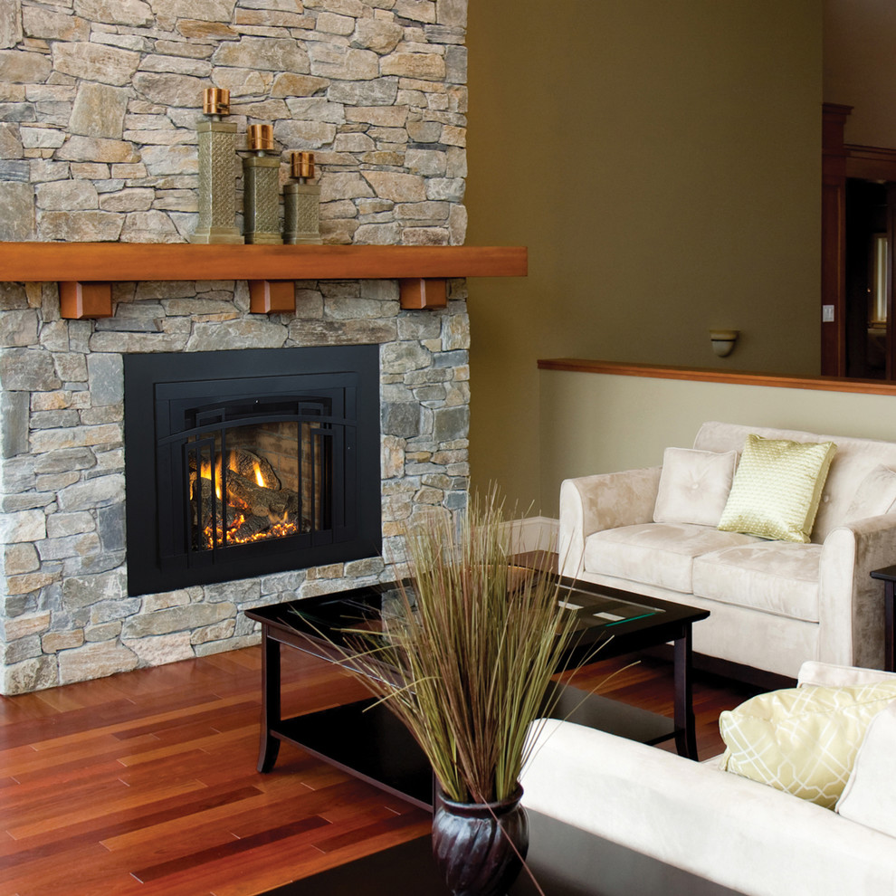 This is an example of a traditional living room in Orange County with a standard fireplace.