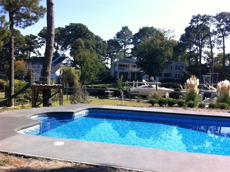 Inspiration for a backyard custom-shaped pool remodel