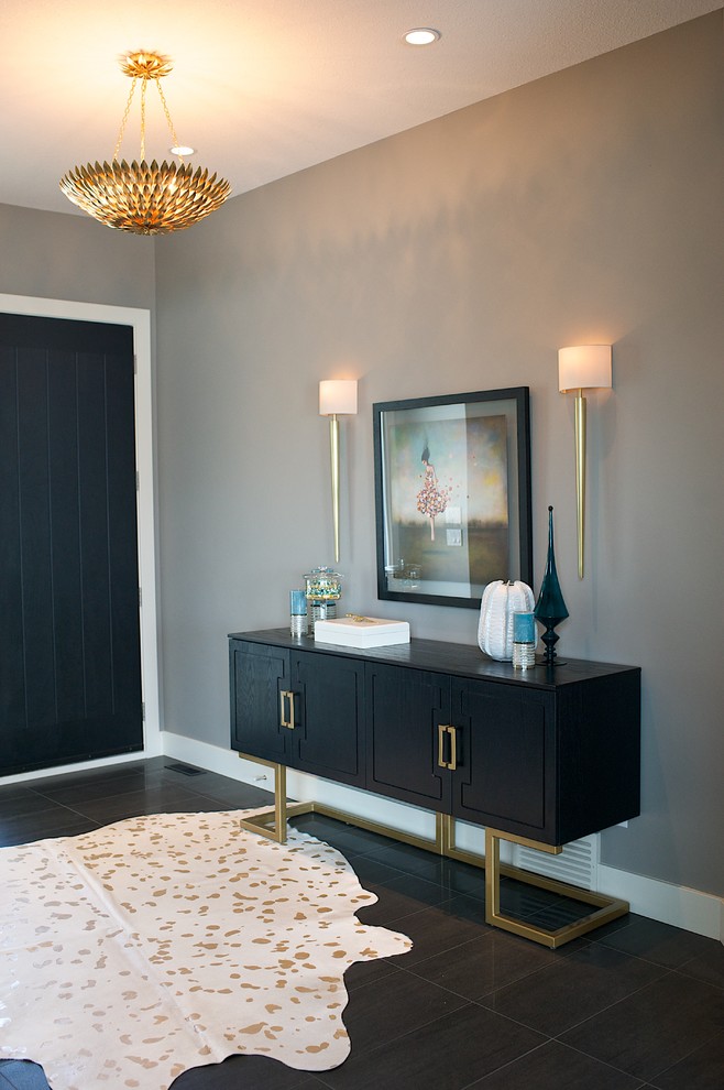 Design ideas for a mid-sized transitional foyer in Edmonton with grey walls, porcelain floors, a single front door and a black front door.