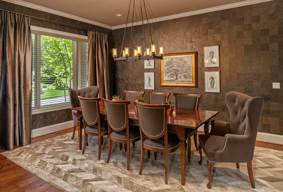 Inspiration for a traditional dining room in Seattle with brown walls and dark hardwood floors.