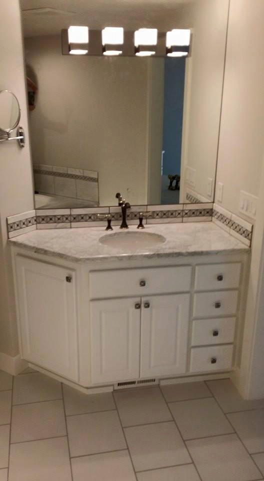 Example of a master multicolored tile white floor bathroom design in Portland with raised-panel cabinets, white cabinets, beige walls, an undermount sink, granite countertops and white countertops