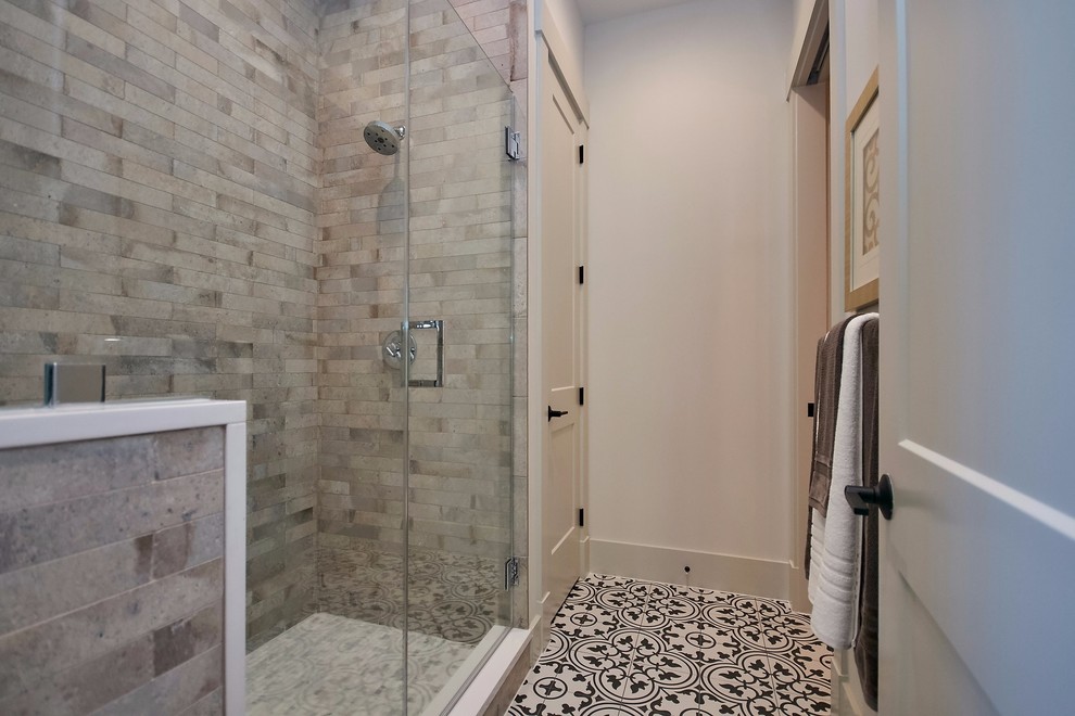 Photo of a mid-sized country bathroom in DC Metro with shaker cabinets, dark wood cabinets, an alcove shower, beige tile, ceramic tile, white walls, cement tiles, engineered quartz benchtops, multi-coloured floor, a hinged shower door and white benchtops.