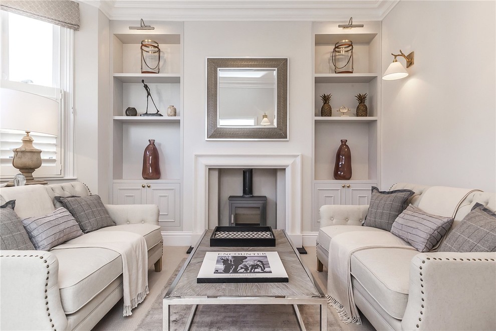 Inspiration for a transitional formal living room in London with grey walls, carpet and a wood stove.