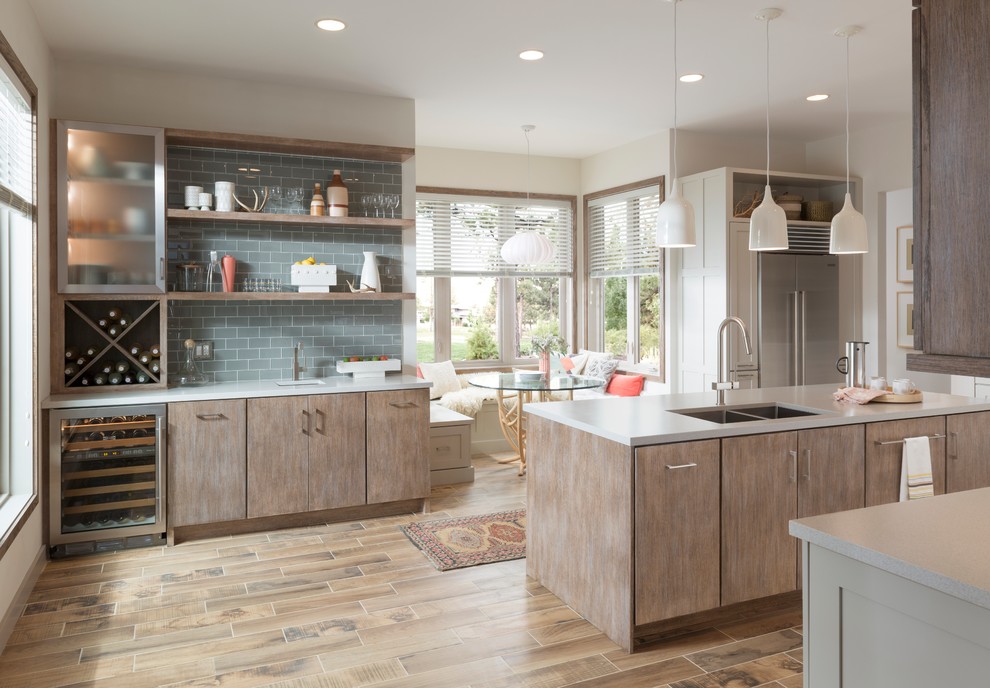 Inspiration for a large contemporary single-wall eat-in kitchen in Minneapolis with a double-bowl sink, flat-panel cabinets, distressed cabinets, quartz benchtops, blue splashback, subway tile splashback, stainless steel appliances, with island, medium hardwood floors, beige floor and white benchtop.