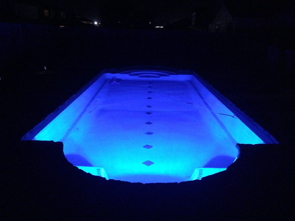 Inspiration for a large modern indoor concrete and custom-shaped indoor pool remodel in Austin