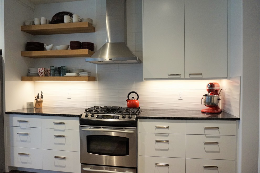 Example of a transitional kitchen design in Calgary