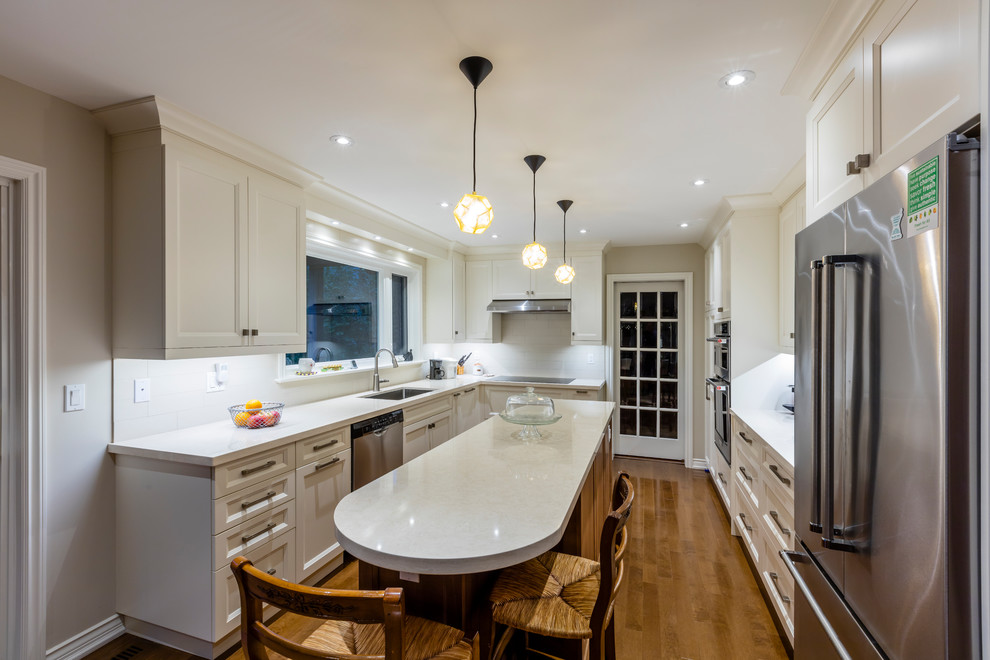 Example of a transitional kitchen design in Toronto