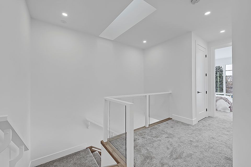Example of a transitional home design design in Calgary