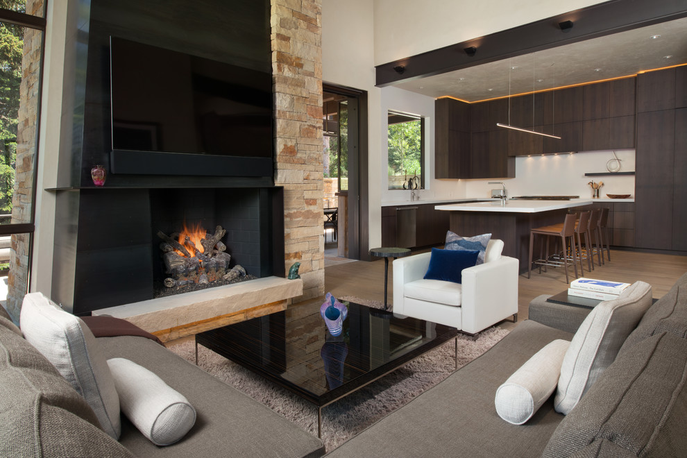 Mid-sized country open concept family room in Denver with white walls, medium hardwood floors, a standard fireplace, a metal fireplace surround and a wall-mounted tv.