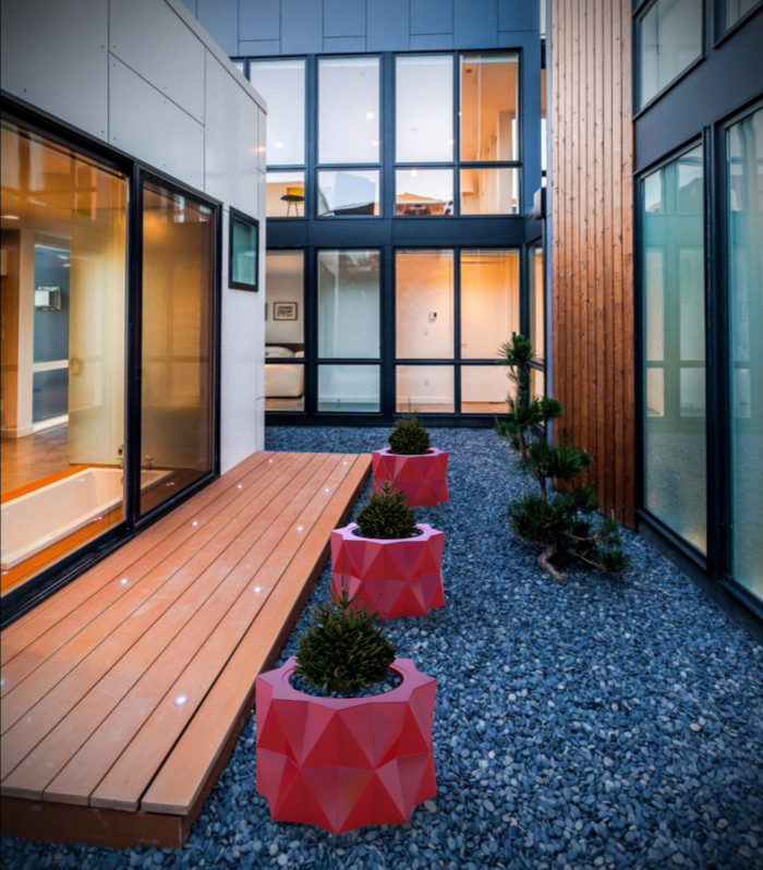 Photo of a large contemporary courtyard patio in Toronto with a container garden and gravel.