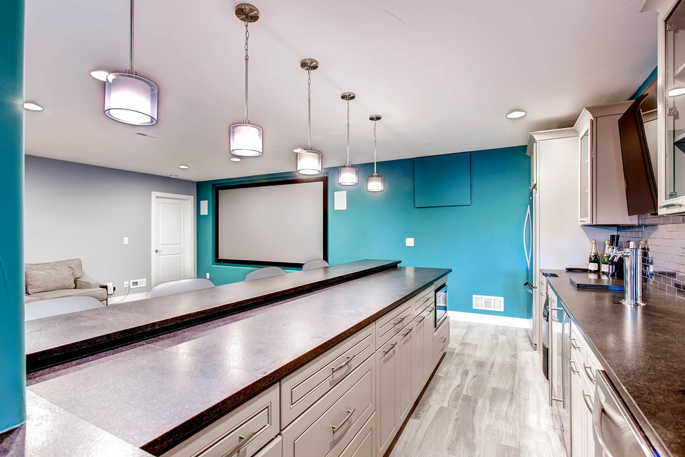 Inspiration for a large transitional open concept carpeted and gray floor kitchen remodel in Denver with gray walls and a projector screen