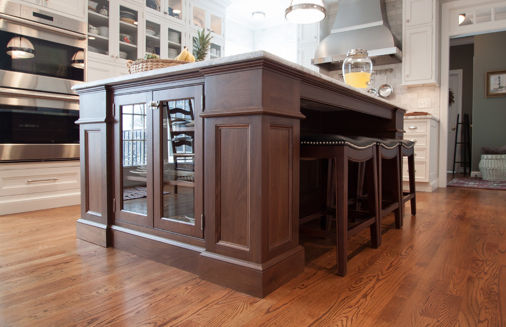 Example of a large transitional kitchen design in DC Metro with beaded inset cabinets, white cabinets, marble countertops, white backsplash, subway tile backsplash, stainless steel appliances and an island