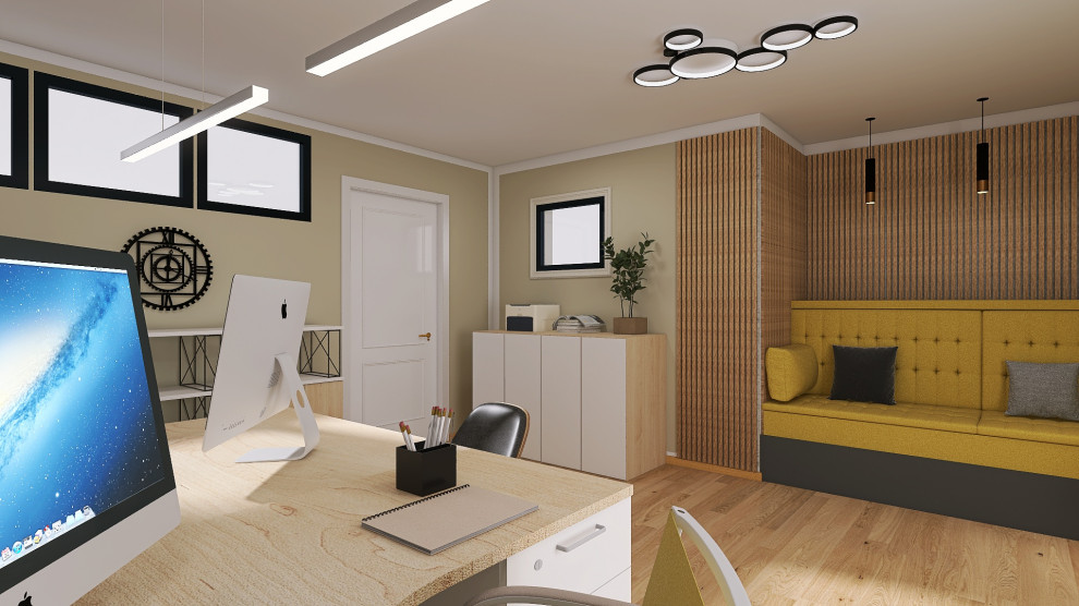 Источник вдохновения для домашнего уюта: огромное рабочее место в стиле лофт с желтыми стенами, паркетным полом среднего тона и отдельно стоящим рабочим столом