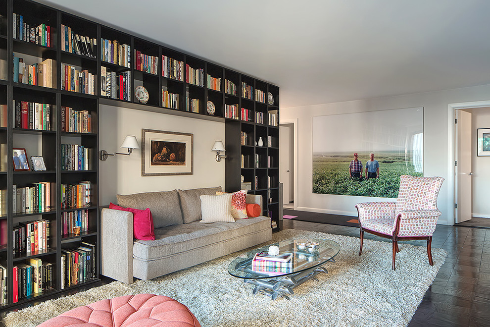 Photo of a contemporary living room in New York with a library and no tv.