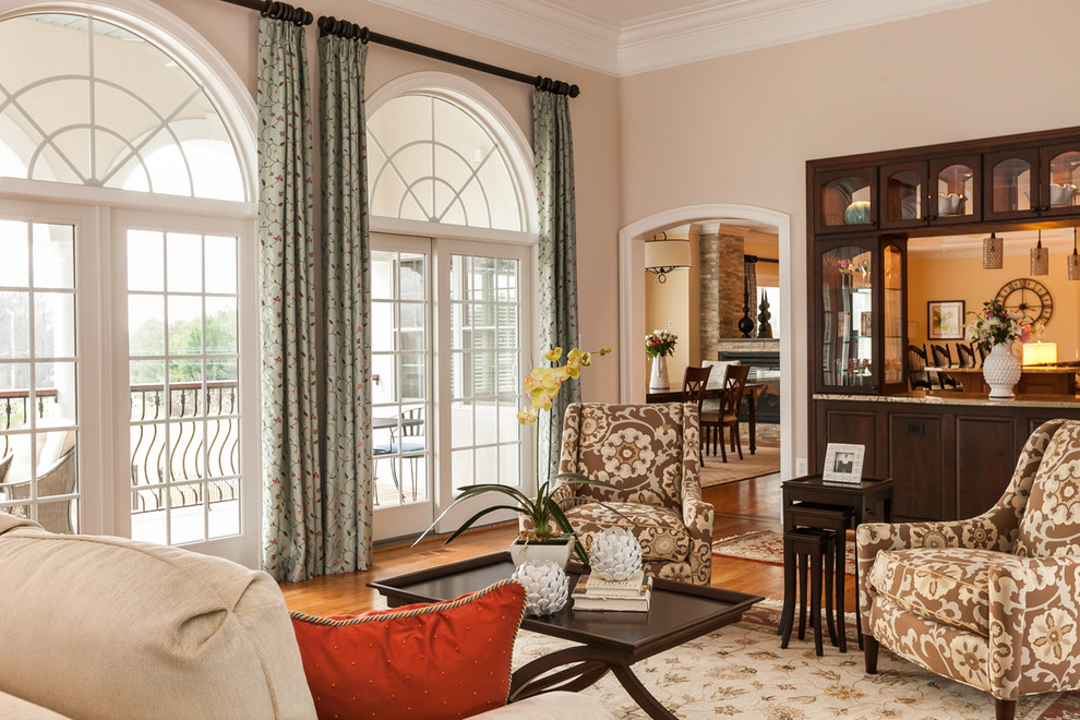 Inspiration for a large traditional formal open concept living room in Baltimore with beige walls, light hardwood floors, no fireplace, no tv and brown floor.