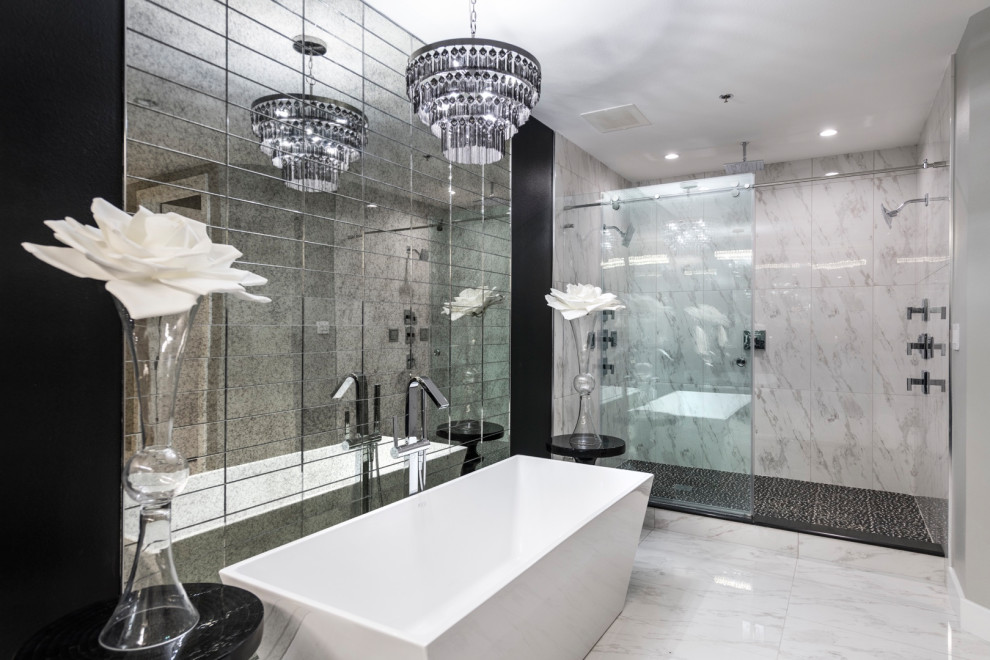 This is an example of a large contemporary bathroom in Las Vegas with a freestanding tub, gray tile, ceramic tile, ceramic floors, a curbless shower, black walls, white floor and a sliding shower screen.