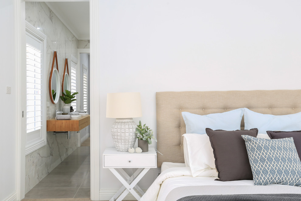Inspiration for an expansive country master bedroom in Wollongong with white walls, carpet and grey floor.