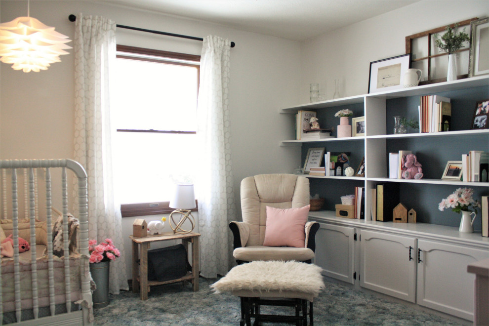 Inspiration for a mid-sized girl carpeted and blue floor nursery remodel with white walls