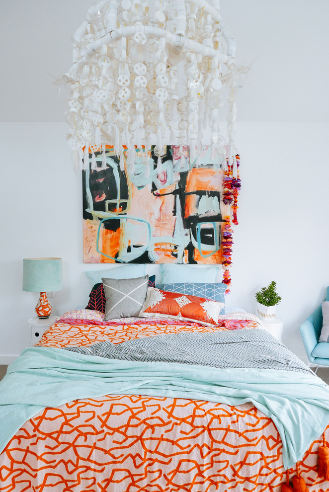 This is an example of an eclectic bedroom in Sydney with white walls.