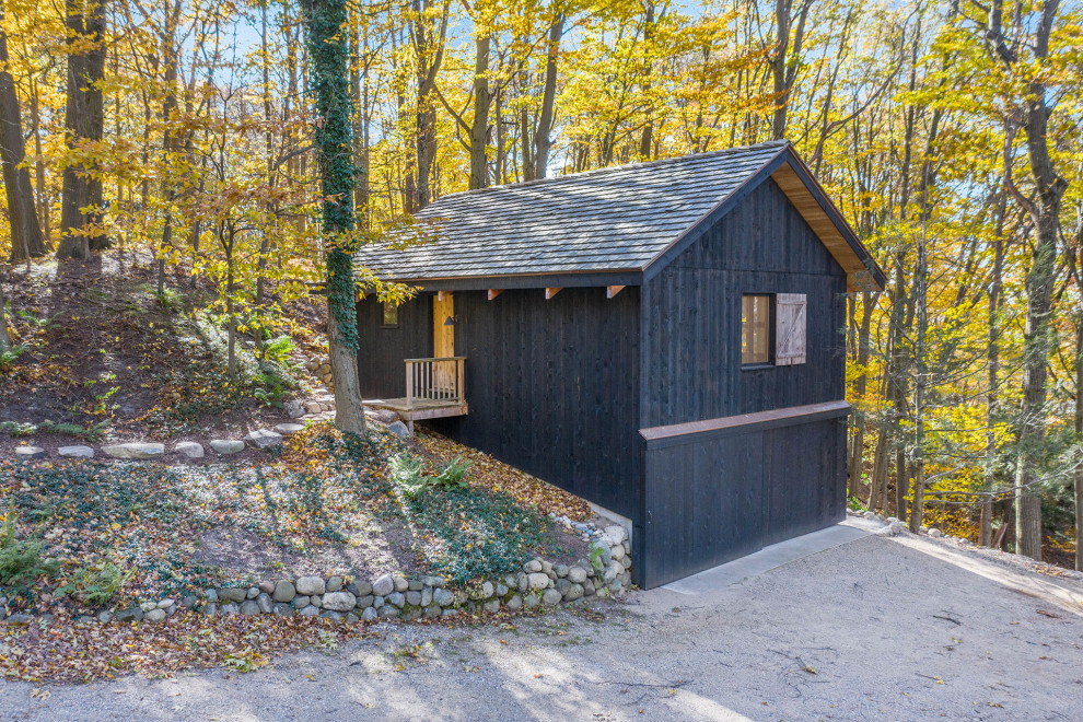 Inspiration for a rustic detached double garage workshop in Grand Rapids.