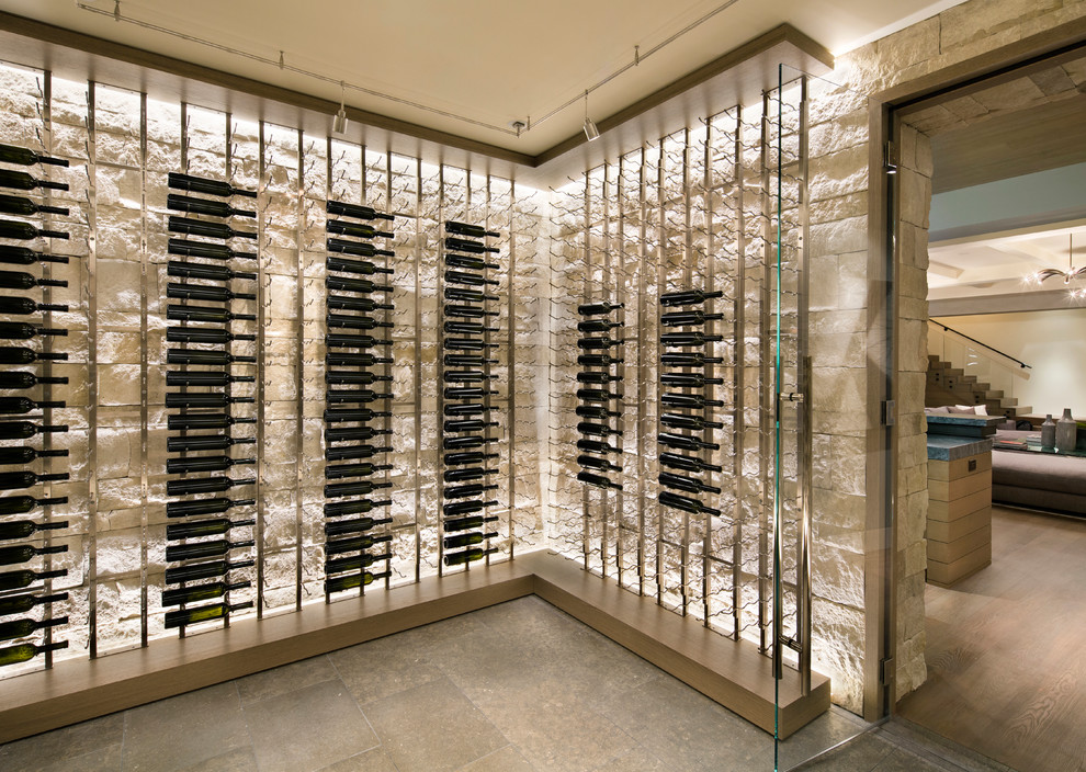 Photo of a large modern wine cellar in San Francisco with slate floors, storage racks and grey floor.