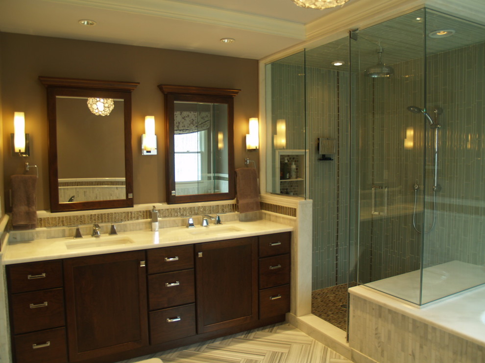 Design ideas for a large transitional master bathroom in New York with shaker cabinets, dark wood cabinets, an undermount tub, an alcove shower, brown tile, glass tile, brown walls, an integrated sink and quartzite benchtops.