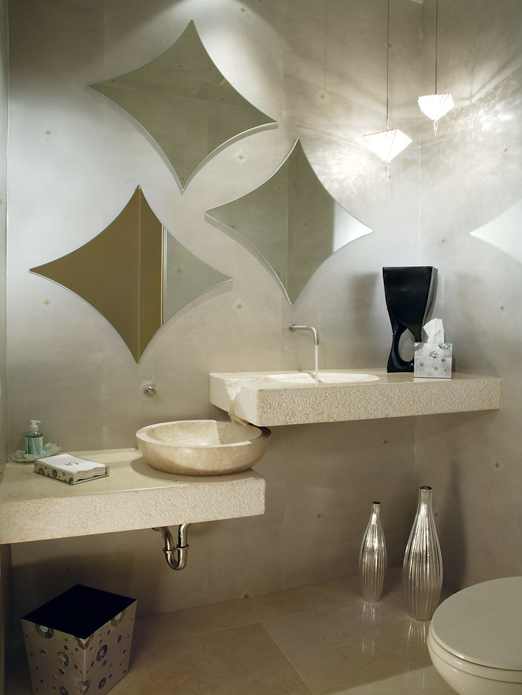 Inspiration for a small contemporary travertine floor and beige floor powder room remodel in Phoenix with a vessel sink, open cabinets, beige cabinets, a two-piece toilet, beige walls, quartz countertops and beige countertops