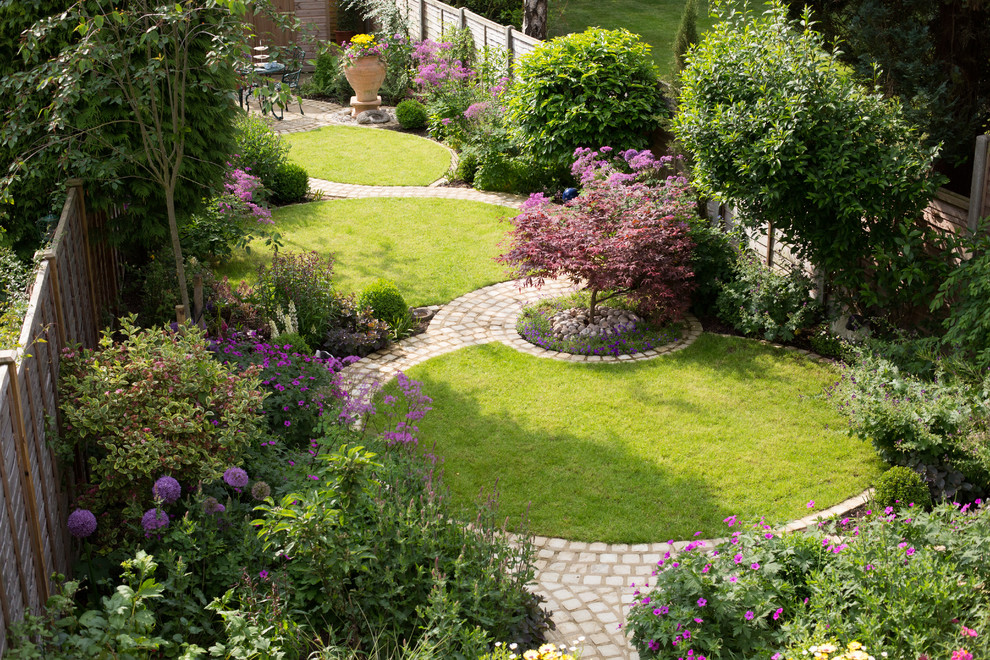 Design ideas for a mid-sized traditional backyard garden in Cheshire.