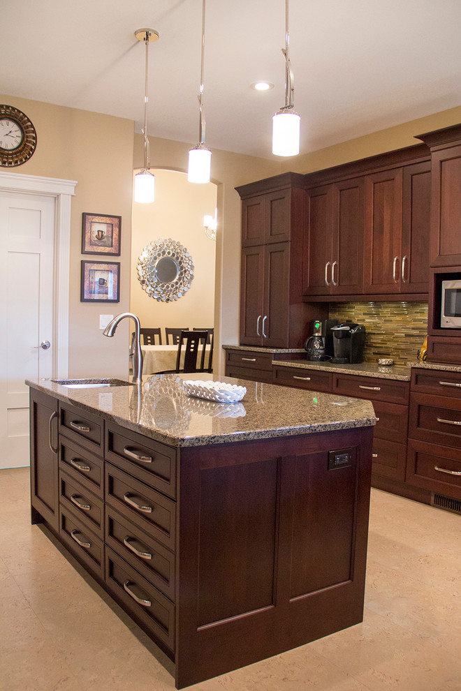 Inspiration for a mid-sized transitional l-shaped enclosed kitchen remodel with an undermount sink, recessed-panel cabinets, medium tone wood cabinets, granite countertops, stainless steel appliances and an island