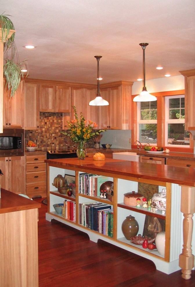 Example of a mid-sized country u-shaped medium tone wood floor open concept kitchen design in Portland with a farmhouse sink, beaded inset cabinets, light wood cabinets, granite countertops, multicolored backsplash, mosaic tile backsplash, stainless steel appliances and an island