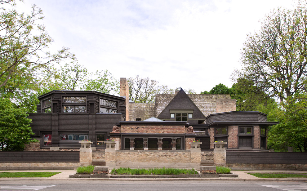 Arts and crafts two-storey brown house exterior in Chicago with wood siding.