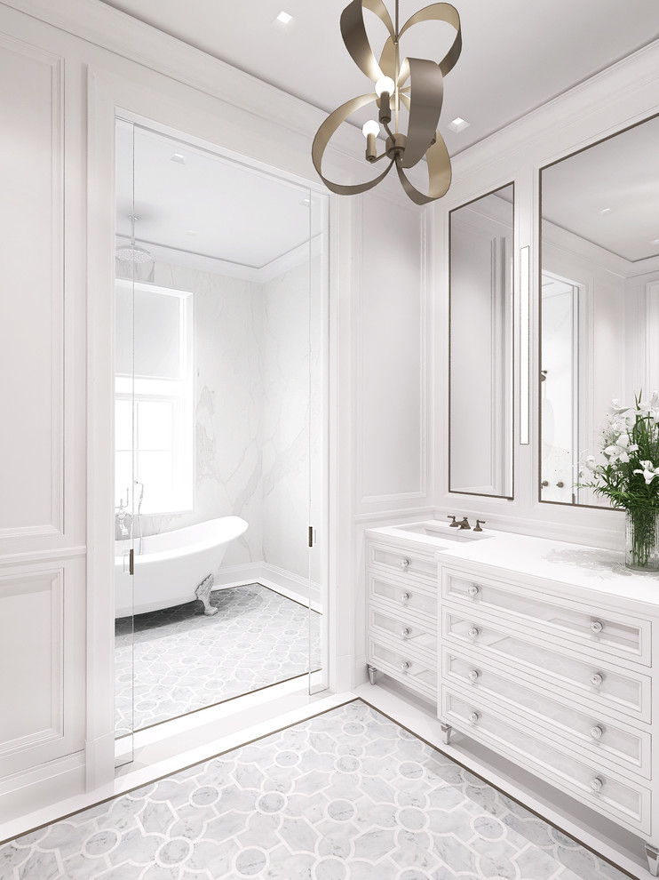 Inspiration for a large transitional master bathroom in New York with recessed-panel cabinets, white cabinets, a freestanding tub, a shower/bathtub combo, a wall-mount toilet, white tile, stone slab, white walls, mosaic tile floors, an undermount sink and marble benchtops.