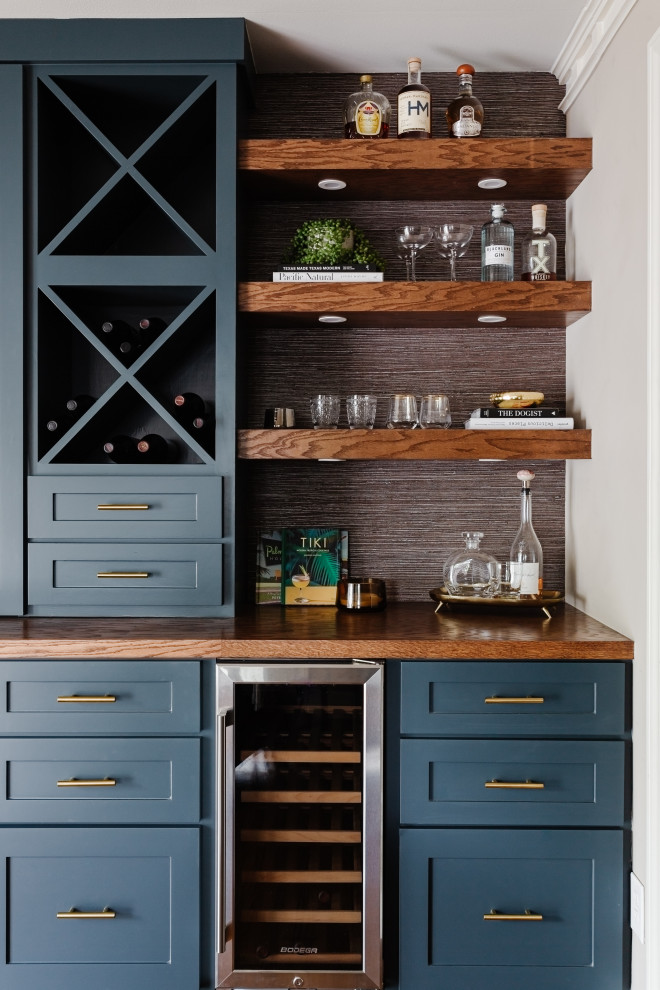 Inspiration for a mid-sized modern single-wall home bar in Dallas with shaker cabinets, blue cabinets, wood benchtops, dark hardwood floors, brown floor and brown benchtop.