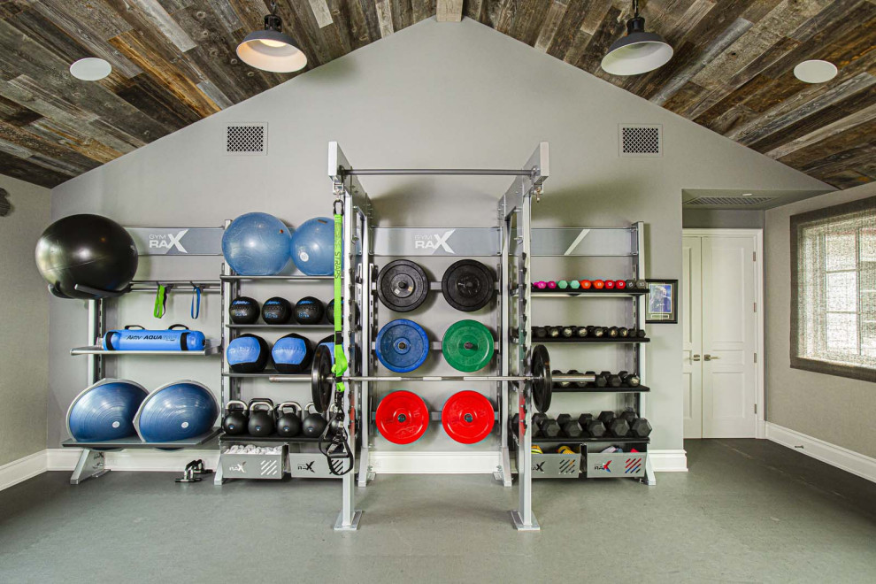 Inspiration for a mid-sized modern home weight room in Los Angeles with grey walls, grey floor and wood.