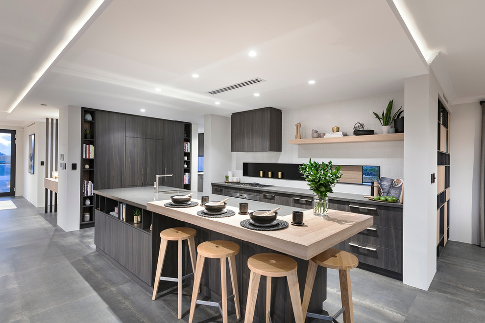 Design ideas for a contemporary l-shaped kitchen in Perth with an undermount sink, flat-panel cabinets, dark wood cabinets, panelled appliances, with island, grey floor and grey benchtop.