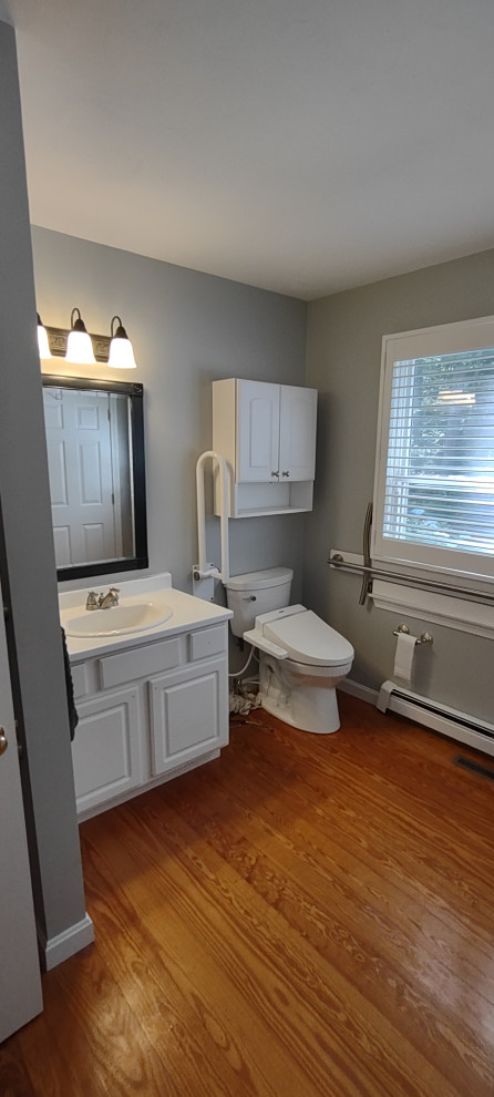 Replaced vanity with pedestal replaced wood floor with tile. Installed grab bars