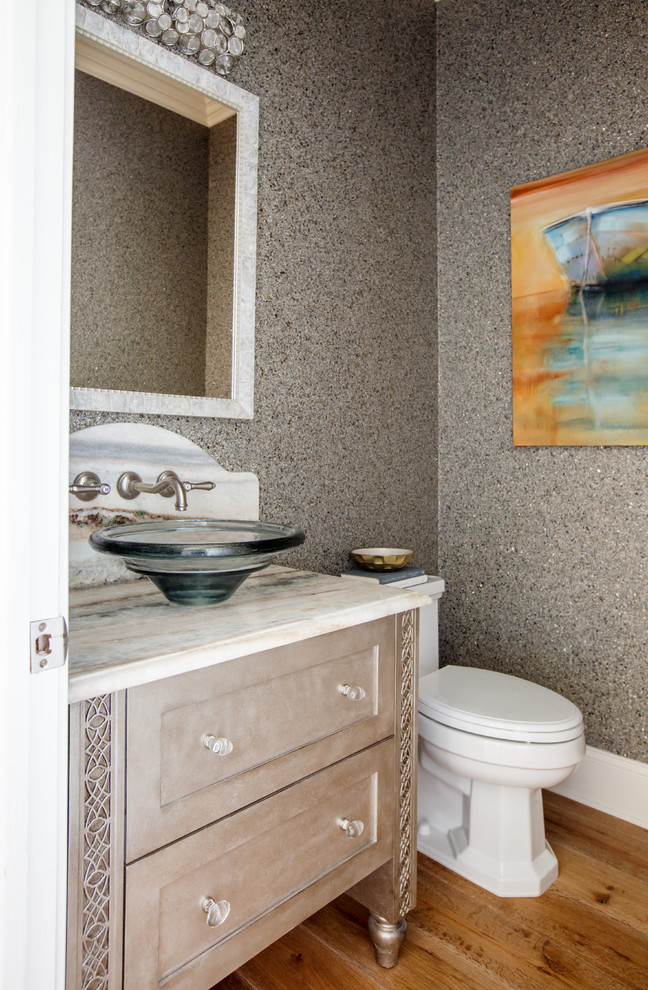 Design ideas for a small beach style bathroom in Jacksonville with shaker cabinets, grey cabinets, a vessel sink, onyx benchtops, blue walls and medium hardwood floors.