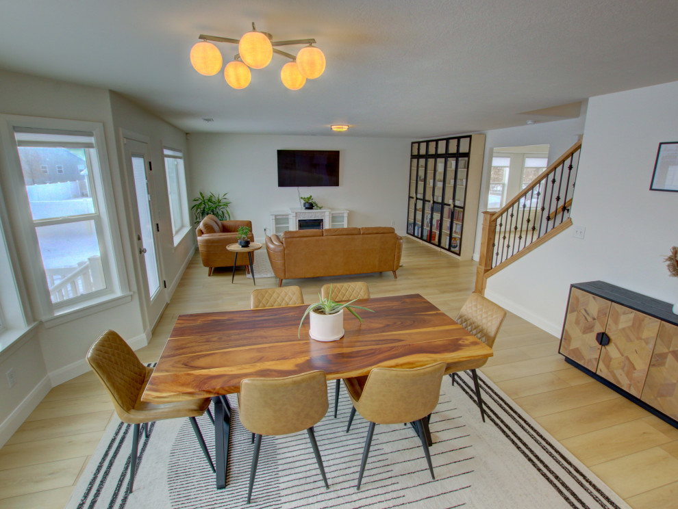 Esempio di una sala da pranzo aperta verso la cucina moderna di medie dimensioni con pareti bianche, pavimento in vinile e pavimento beige