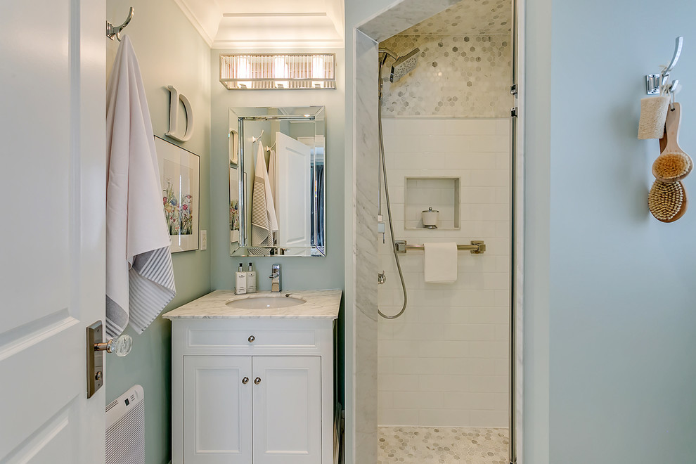 Small transitional master white tile and mosaic tile mosaic tile floor and multicolored floor corner shower photo in Toronto with recessed-panel cabinets, white cabinets, green walls, an undermount sink, quartzite countertops and white countertops