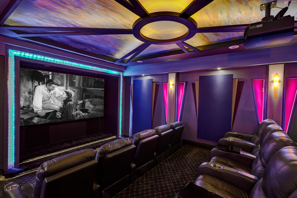 This is an example of a large modern enclosed home theatre in Chicago with purple walls, carpet, a wall-mounted tv and brown floor.