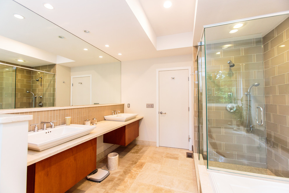 Photo of a large transitional master bathroom in Boston with flat-panel cabinets, a corner shower, beige tile, beige walls and ceramic floors.