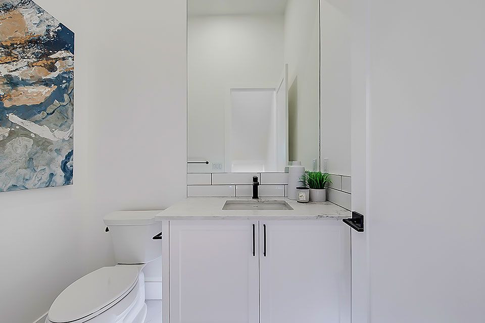 Example of a transitional home design design in Calgary
