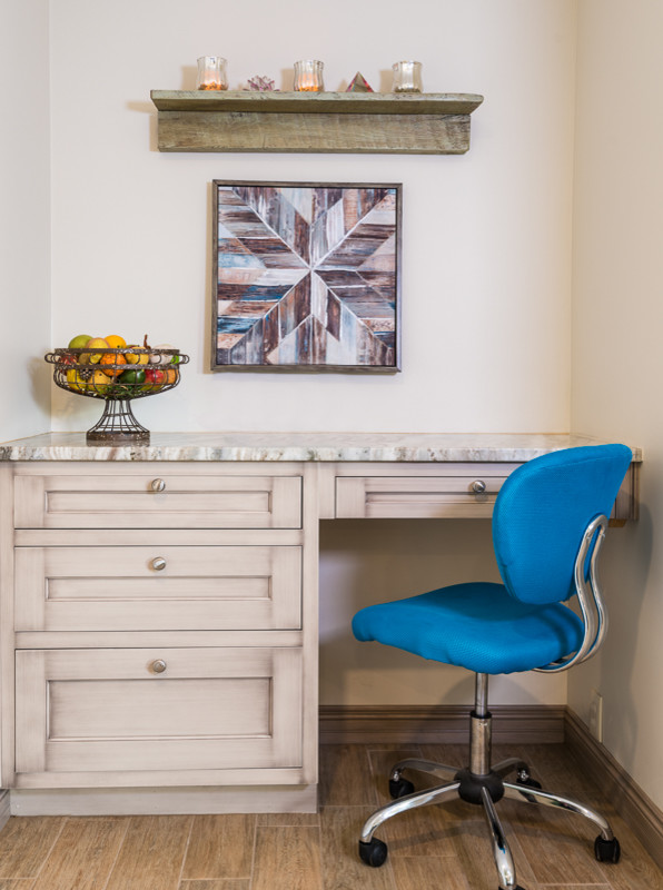 Eat-in kitchen - transitional single-wall porcelain tile eat-in kitchen idea with an undermount sink, recessed-panel cabinets, distressed cabinets, granite countertops and an island