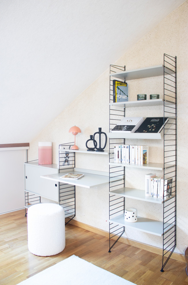 Example of a small trendy built-in desk home office design in Paris