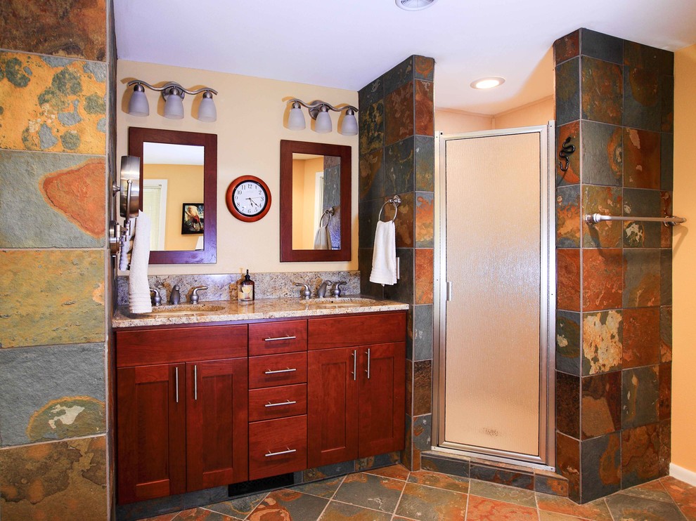 Freestanding bathtub - mid-sized transitional master multicolored tile and stone tile slate floor freestanding bathtub idea in Seattle with an undermount sink, shaker cabinets, medium tone wood cabinets, granite countertops, a two-piece toilet and yellow walls