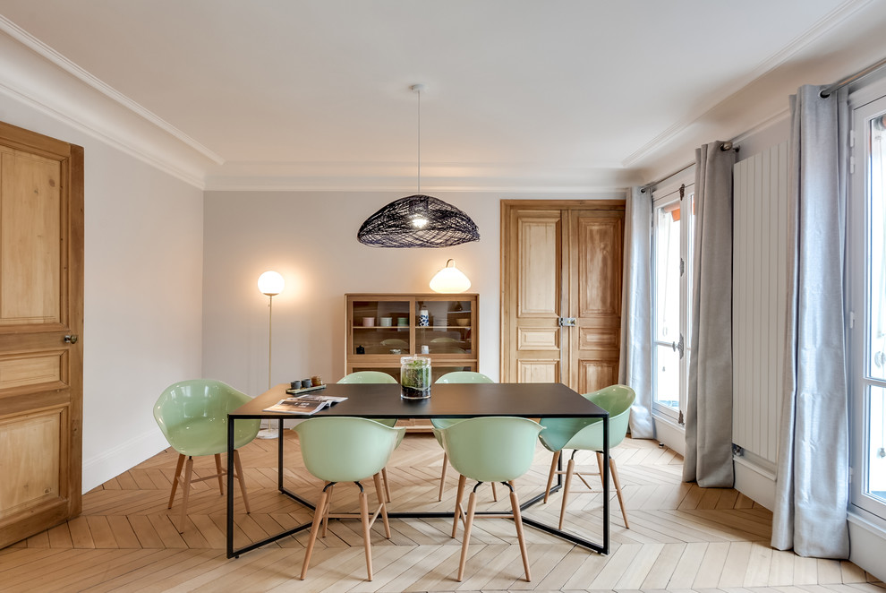 This is an example of a large transitional dining room in Paris with grey walls, light hardwood floors and beige floor.