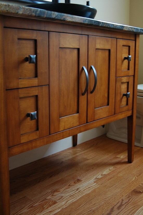 Mid-sized 3/4 medium tone wood floor bathroom photo in Denver with a drop-in sink, dark wood cabinets, quartzite countertops and beige walls