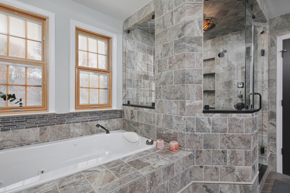 Design ideas for a large transitional master bathroom in Philadelphia with shaker cabinets, black cabinets, a drop-in tub, an alcove shower, stone tile, ceramic floors, an undermount sink and solid surface benchtops.